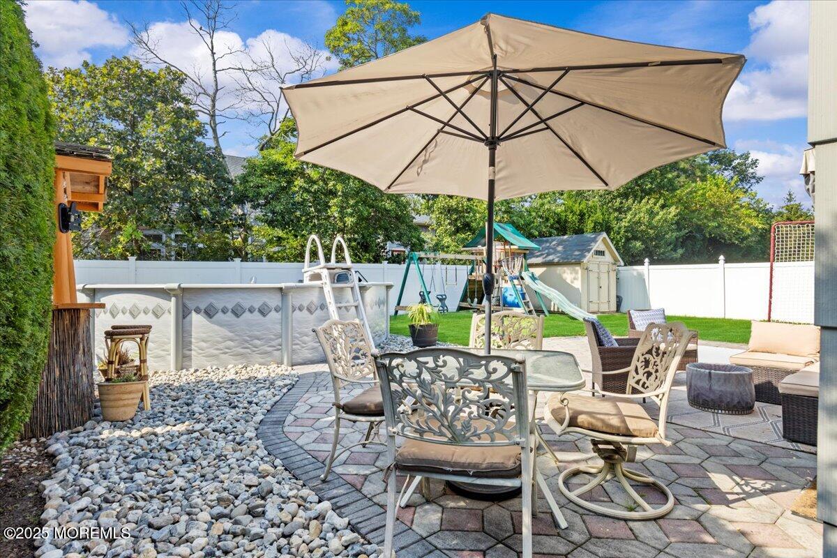 2110 Lanes Mill Road Brick, NJ 08724 - Photo 35 of 55 a patio with a patio table and chairs