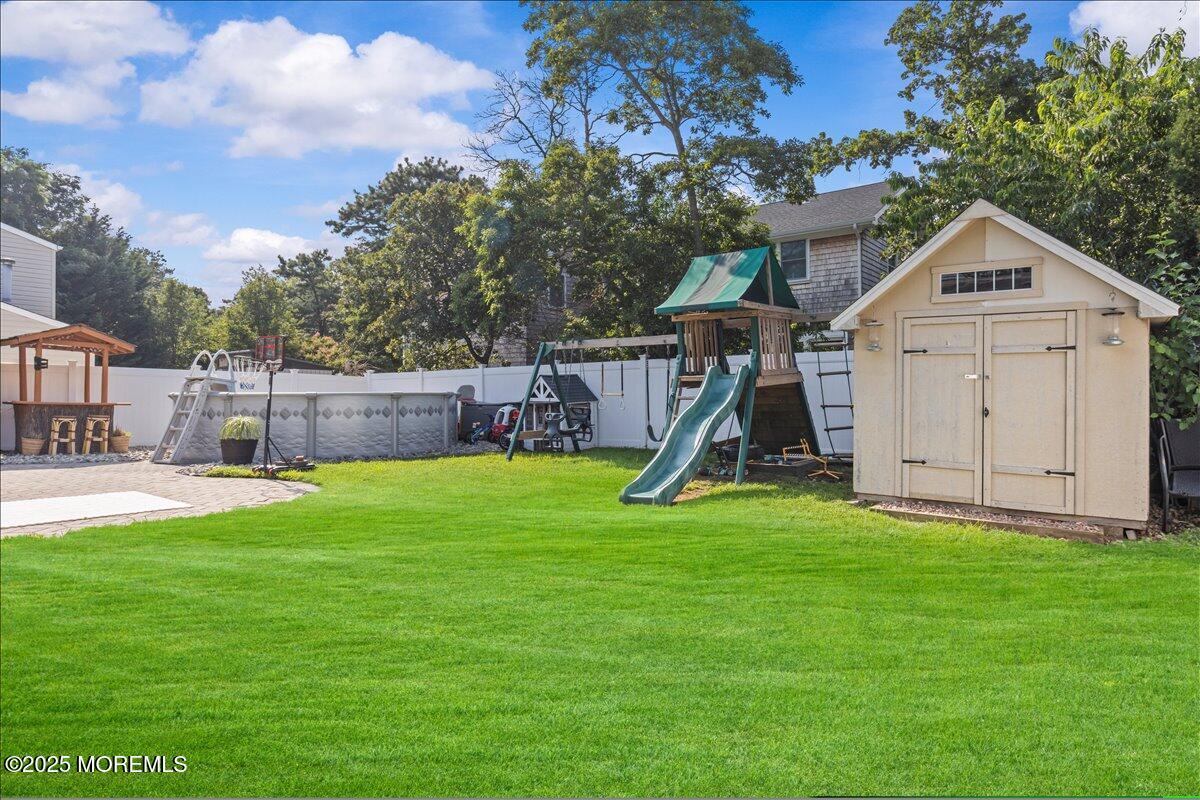 2110 Lanes Mill Road Brick, NJ 08724 - Photo 37 of 55 a view of a house with backyard and a tree