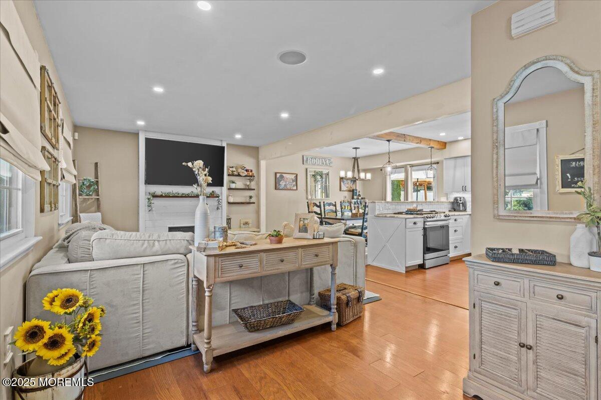 2110 Lanes Mill Road Brick, NJ 08724 - Photo 4 of 55 a large white kitchen with stainless steel appliances granite countertop a stove and cabinets