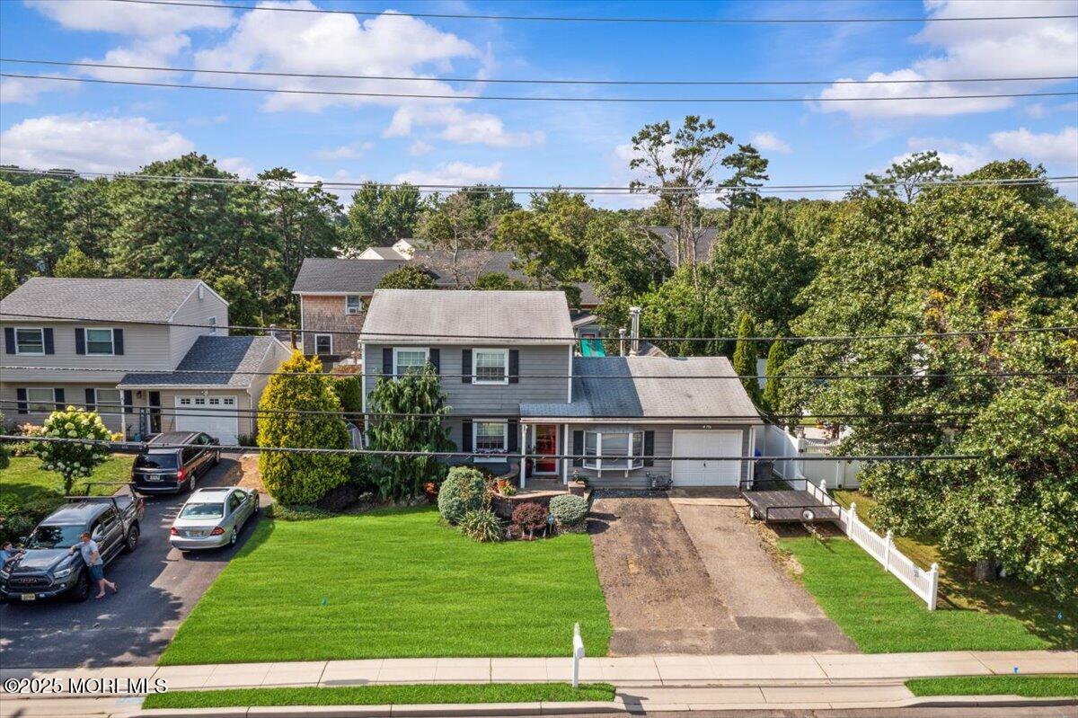 2110 Lanes Mill Road Brick, NJ 08724 - Photo 43 of 55 a front view of a house with a yard