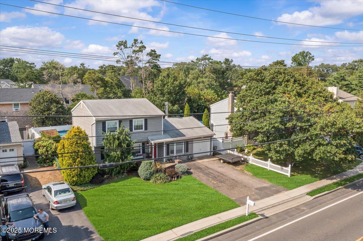 2110 Lanes Mill Road Brick, NJ 08724 - Photo 44 of 55 a front view of a house with garden