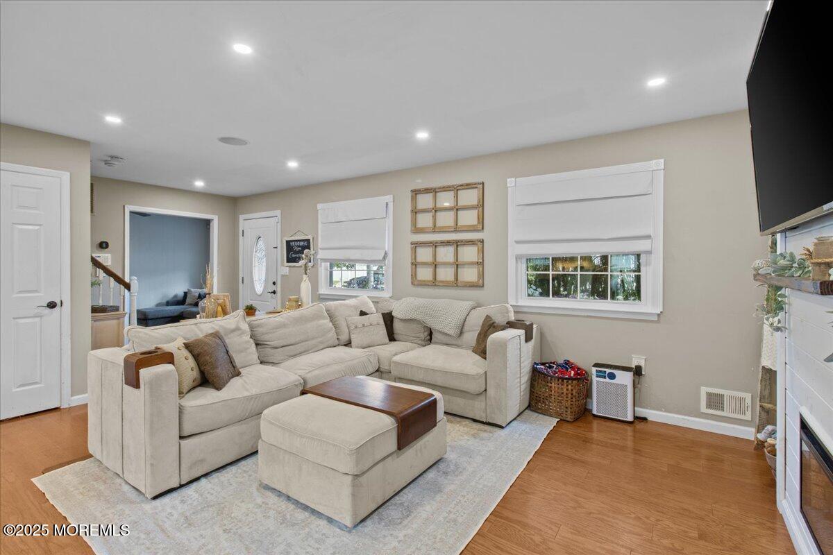 2110 Lanes Mill Road Brick, NJ 08724 - Photo 8 of 55 a living room with furniture and a flat screen tv