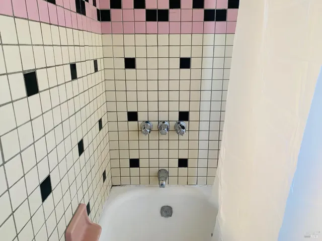 a bathroom with a sink and a shower