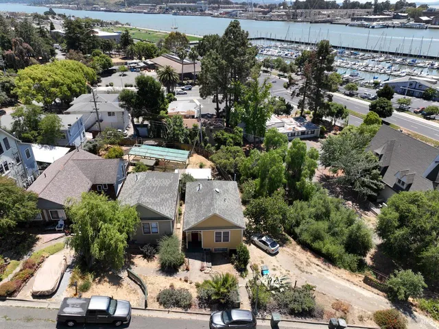 an aerial view of residential houses with outdoor space