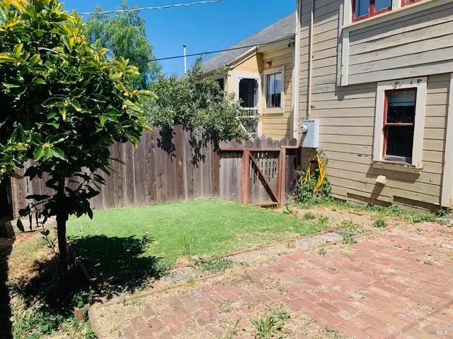 a view of a back yard of the house