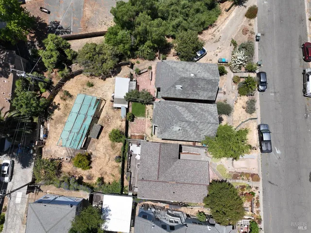 an aerial view of residential houses with outdoor space