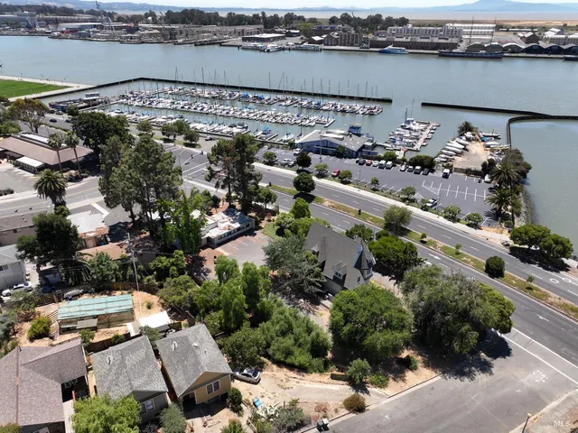 an aerial view of a houses with outdoor space