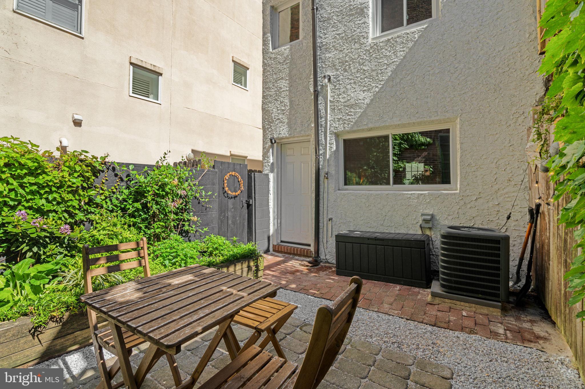 142 Carpenter Street Philadelphia, PA 19147 - Photo 20 of 49 a view of a patio with table and chairs with potted plants
