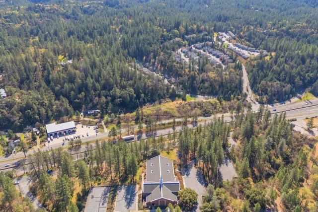a view of a yard with a wooden deck