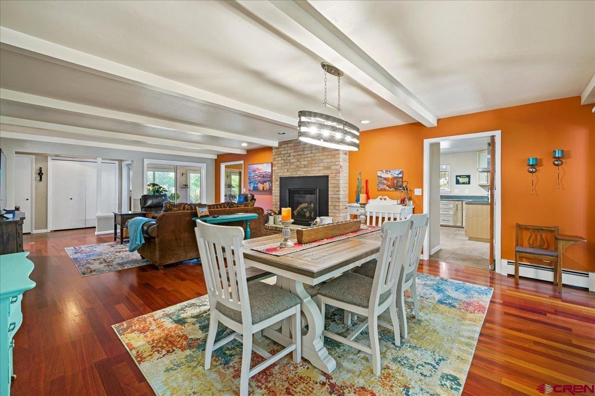 16470 6300th Road Montrose, CO 81403 - Photo 14 of 35 a dining room with furniture a chandelier and wooden floor