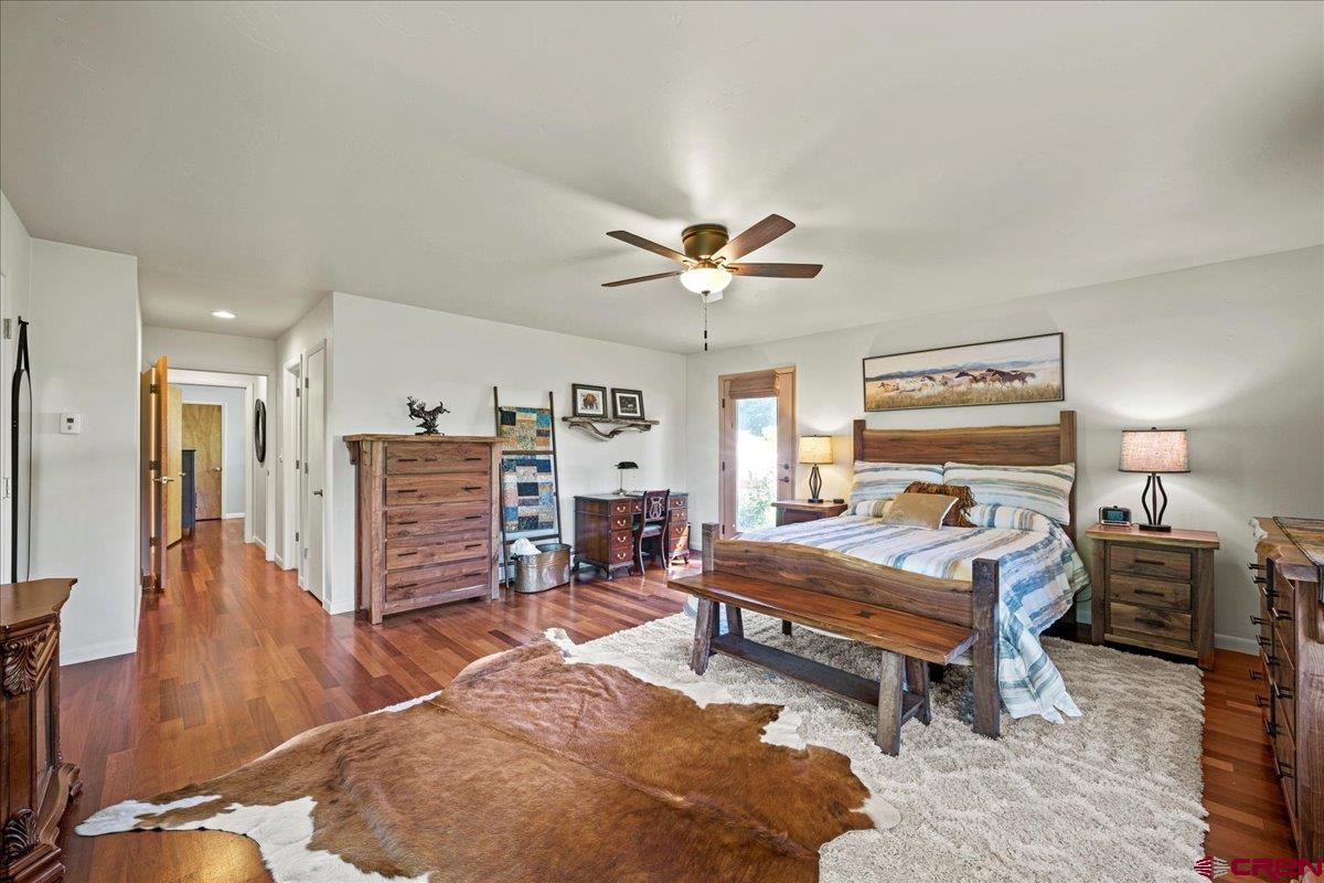 16470 6300th Road Montrose, CO 81403 - Photo 22 of 35 a bedroom with furniture and a wooden floor