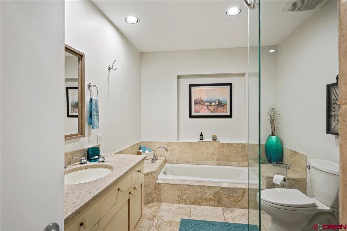 16470 6300th Road Montrose, CO 81403 - Photo 23 of 35 a spacious bathroom with a tub sink and mirror