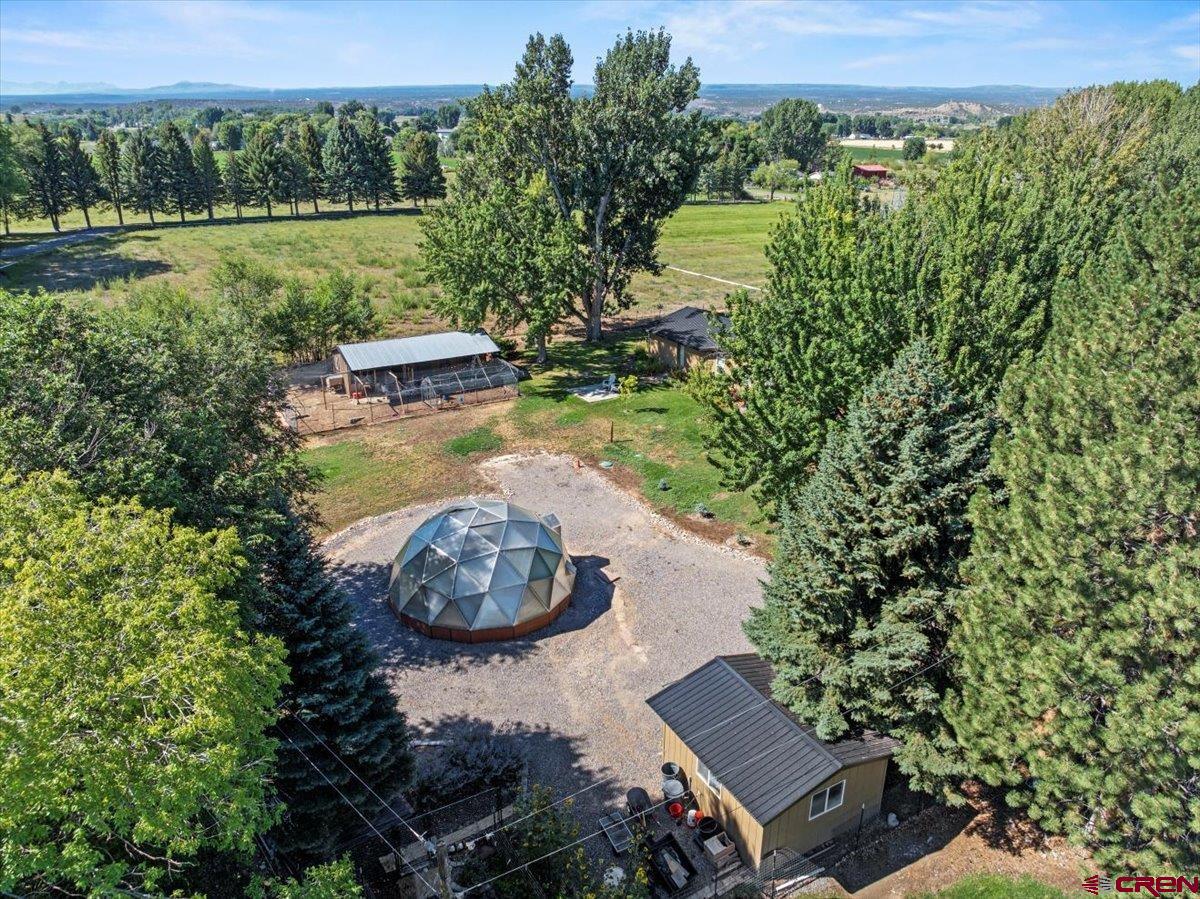 16470 6300th Road Montrose, CO 81403 - Photo 27 of 35 a view of a lake with a house in the background