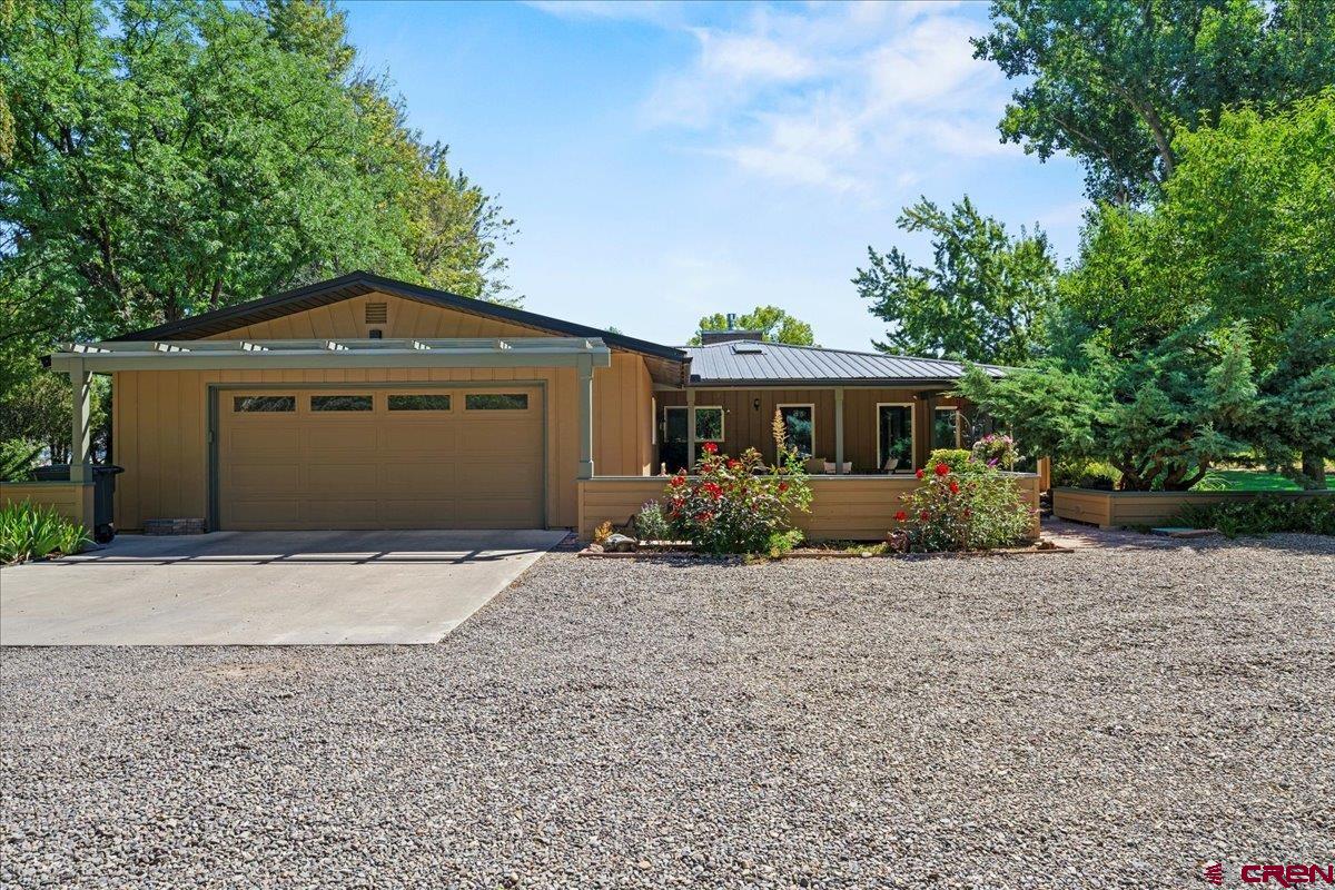 16470 6300th Road Montrose, CO 81403 - Photo 3 of 35 a front view of a house with a yard