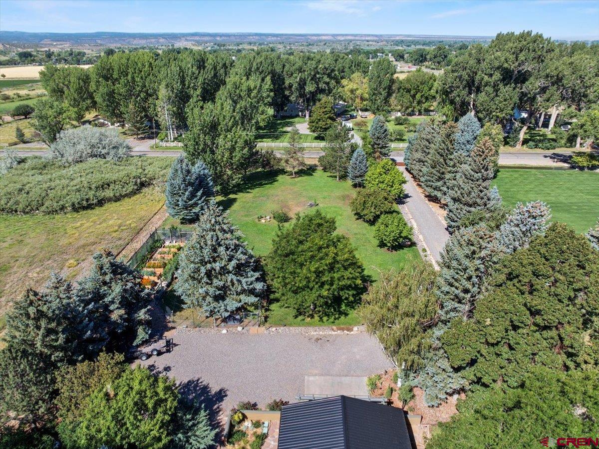 16470 6300th Road Montrose, CO 81403 - Photo 31 of 35 an aerial view of residential house with outdoor space and trees all around