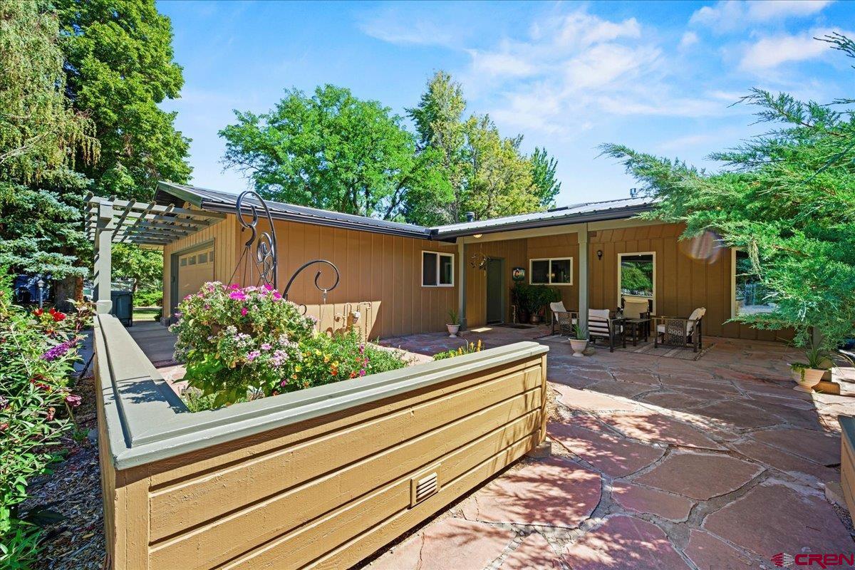 16470 6300th Road Montrose, CO 81403 - Photo 4 of 35 a view of a house with backyard and sitting area