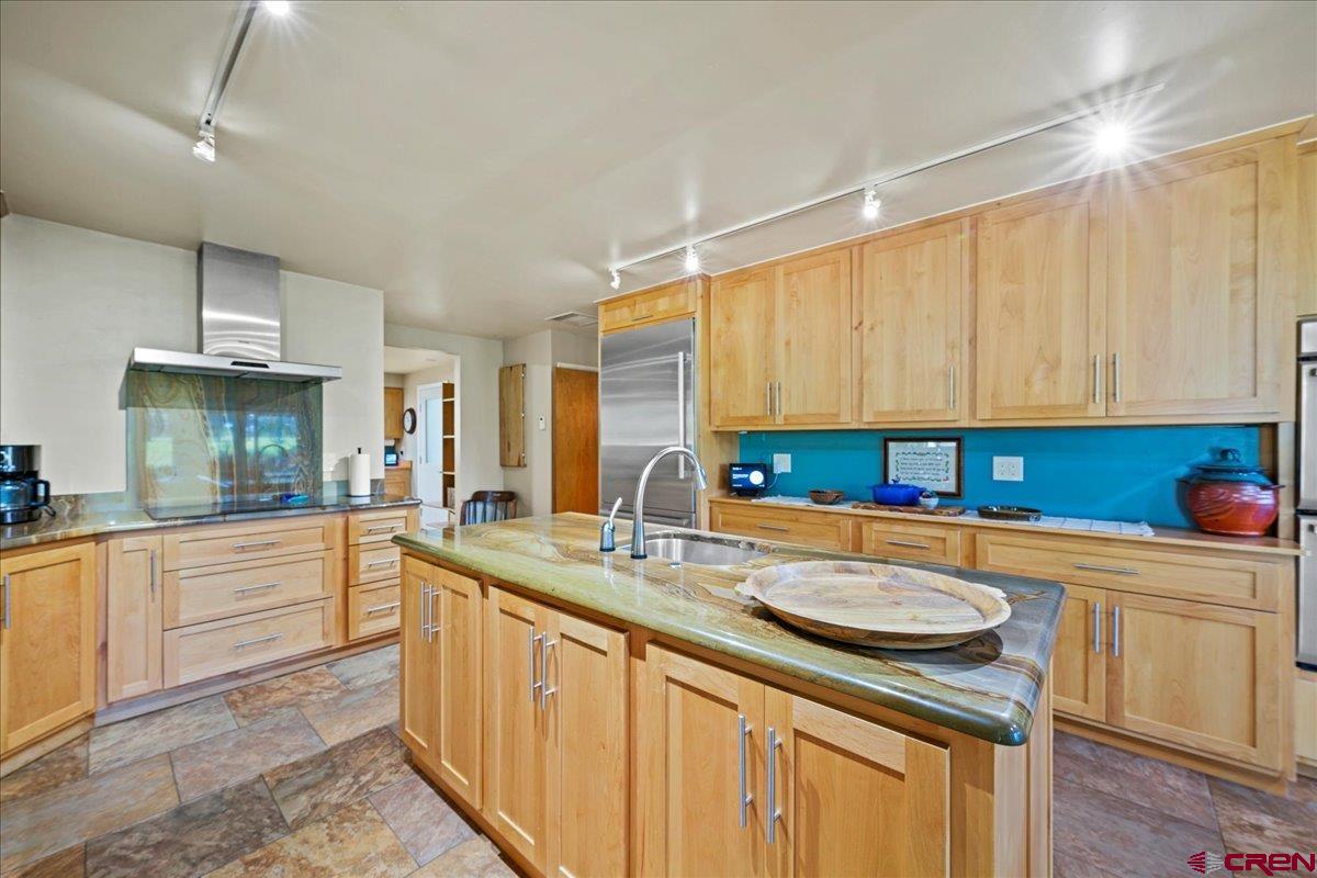 16470 6300th Road Montrose, CO 81403 - Photo 9 of 35 a kitchen with stainless steel appliances granite countertop a sink and cabinets