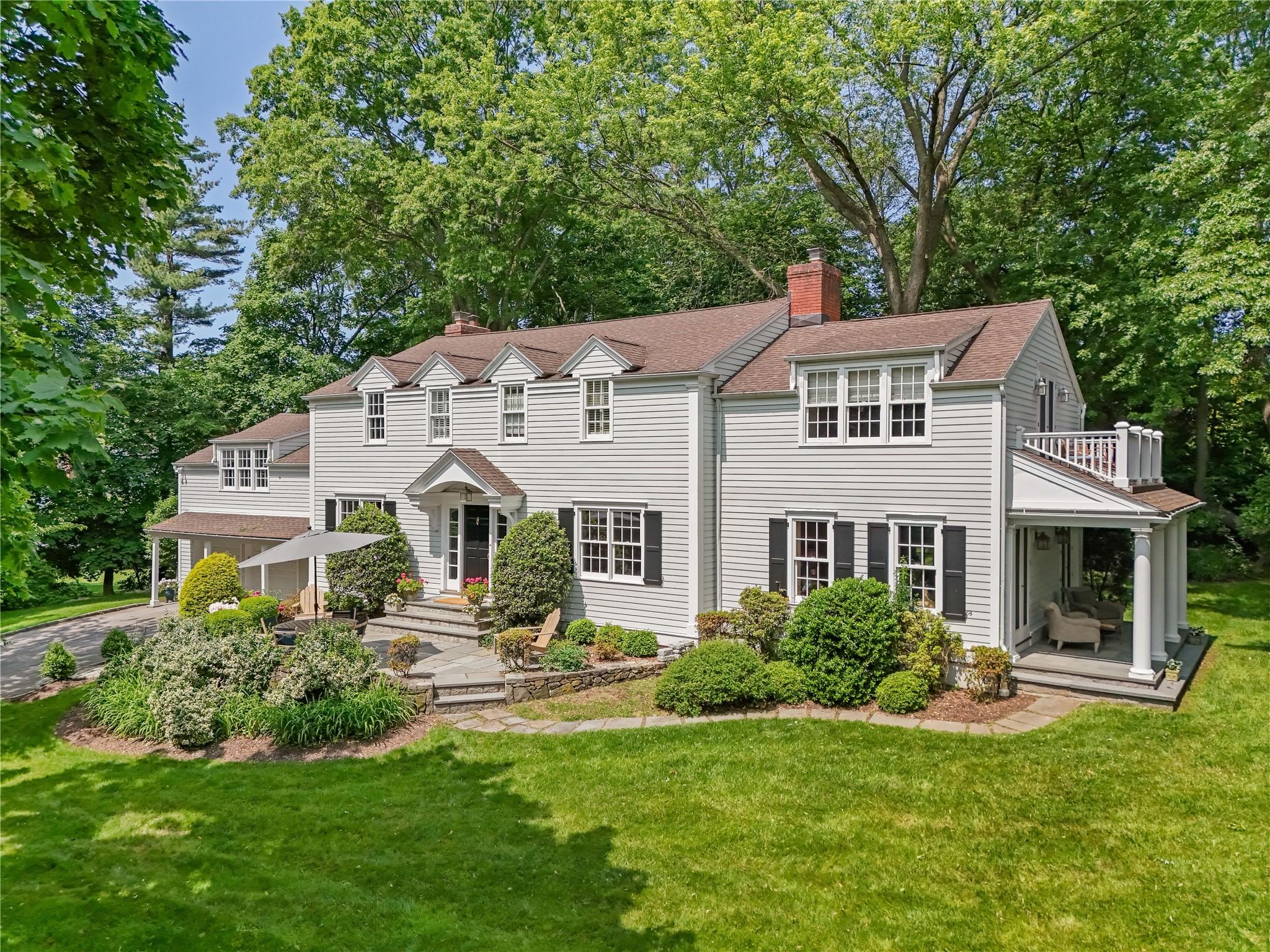 734 Forest Avenue Rye, NY 10580 - Photo 1 of 1 a front view of a house with a garden