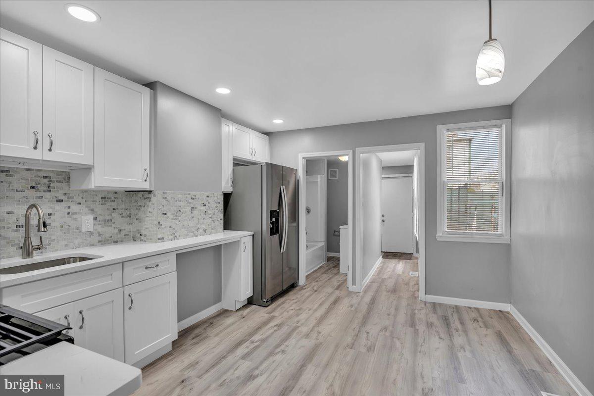 a view of a kitchen with electric appliances