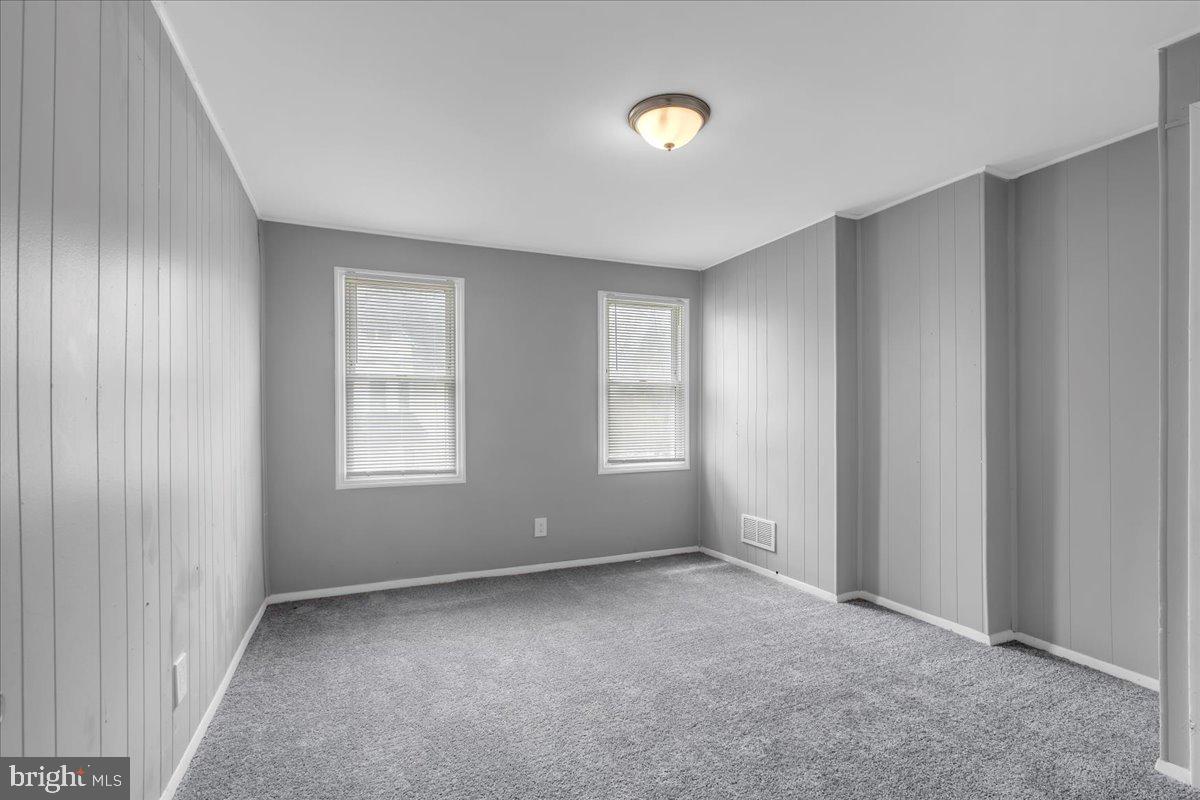 407 Powell Street Gloucester City, NJ 08030 - Photo 12 of 22 an empty room with windows