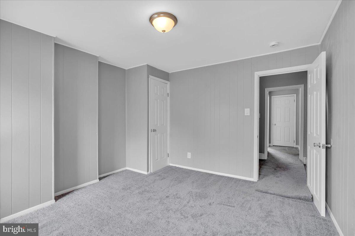 407 Powell Street Gloucester City, NJ 08030 - Photo 13 of 22 a view of an empty room and closet area