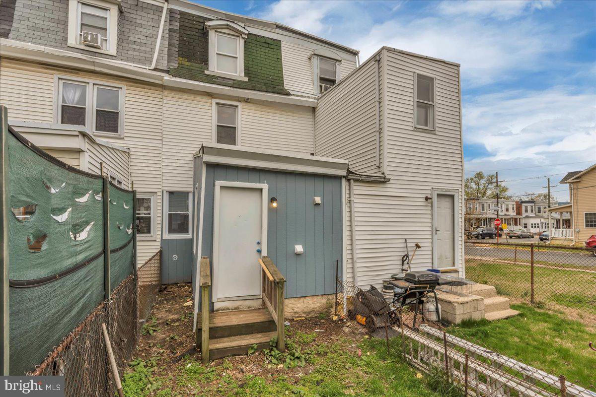 407 Powell Street Gloucester City, NJ 08030 - Photo 21 of 22 a front view of a house with a yard