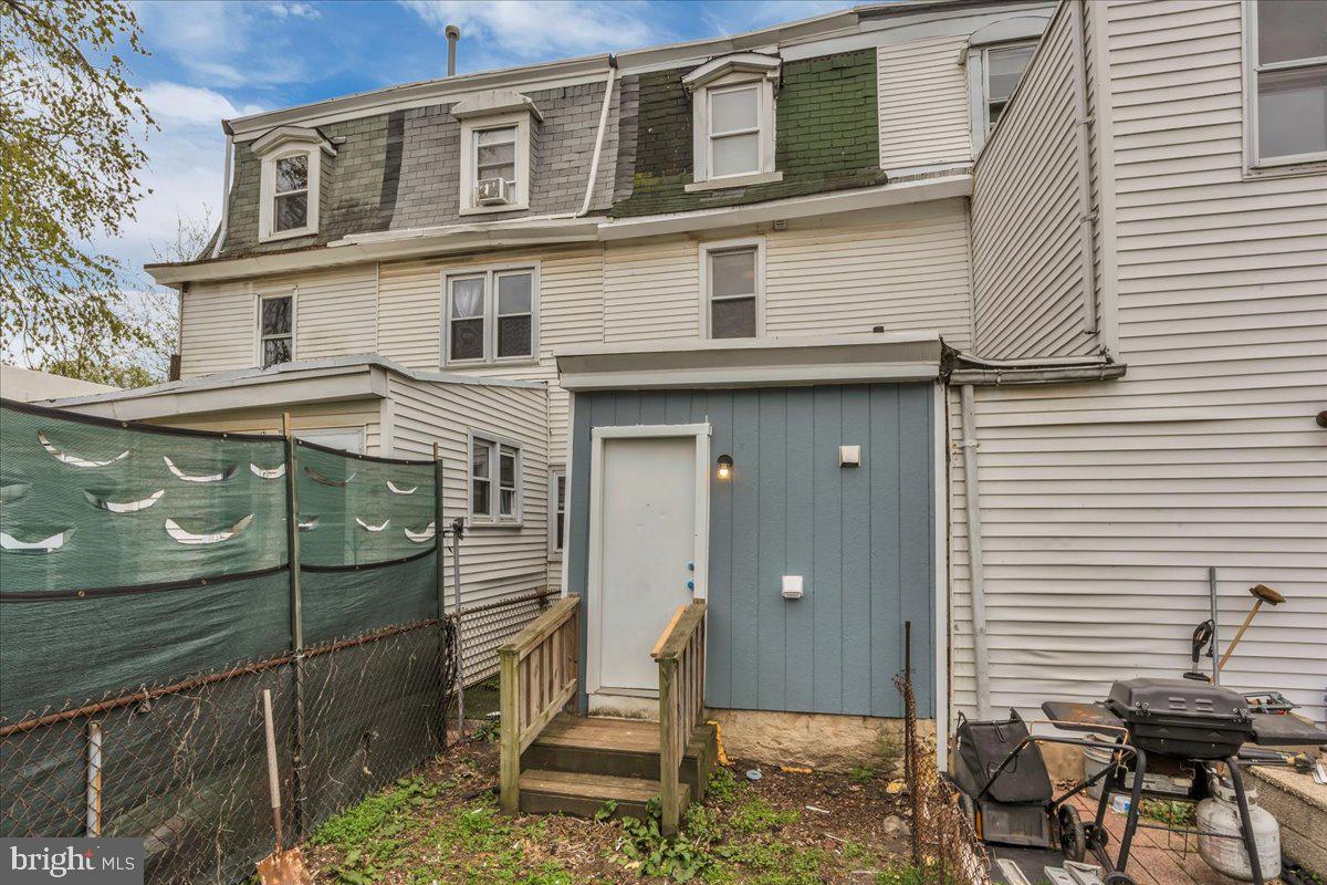 407 Powell Street Gloucester City, NJ 08030 - Photo 22 of 22 a view of a house with a chairs in patio