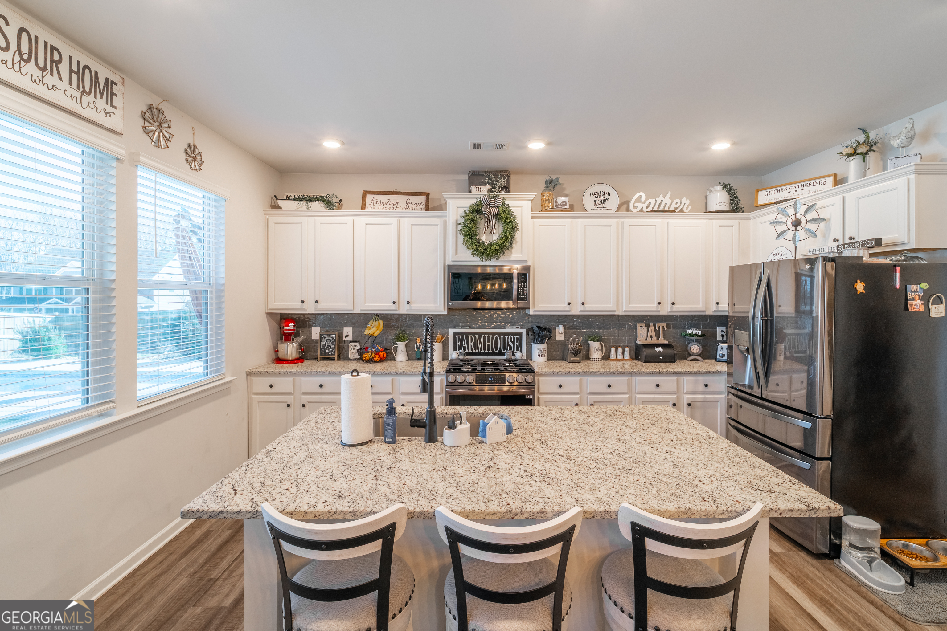728 Cherokee Rose Bremen, GA 30110 - Photo 20 of 78 a kitchen with a refrigerator and white cabinets