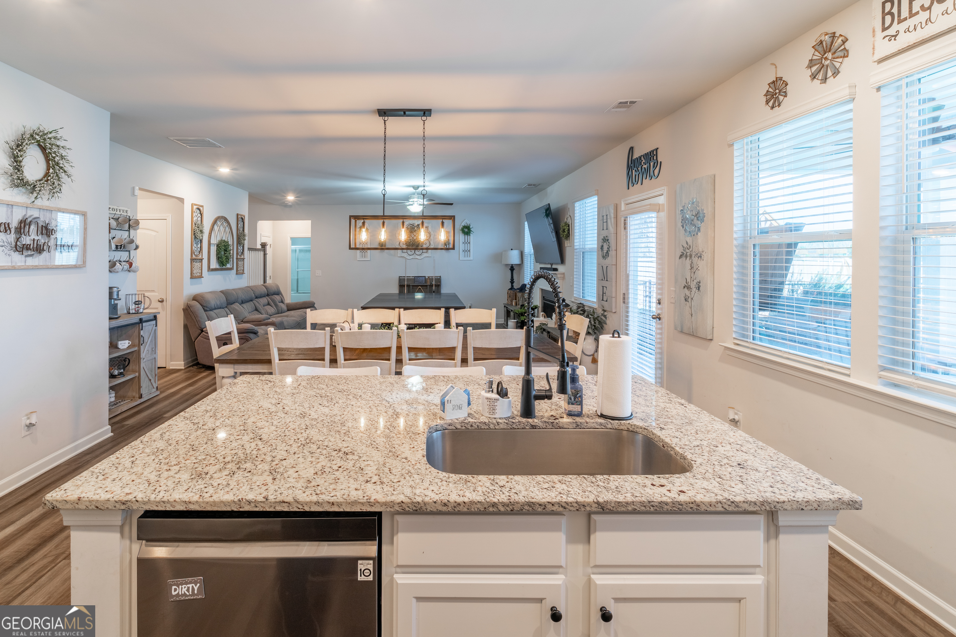 728 Cherokee Rose Bremen, GA 30110 - Photo 26 of 78 a kitchen with granite countertop stainless steel appliances a sink a counter space and a window