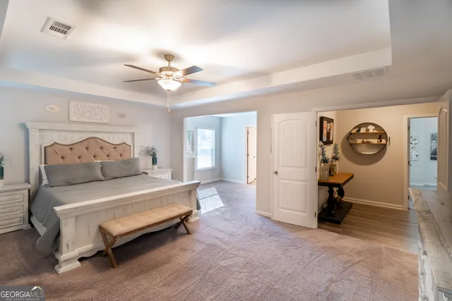a utility room with dryer washer and shoe rack