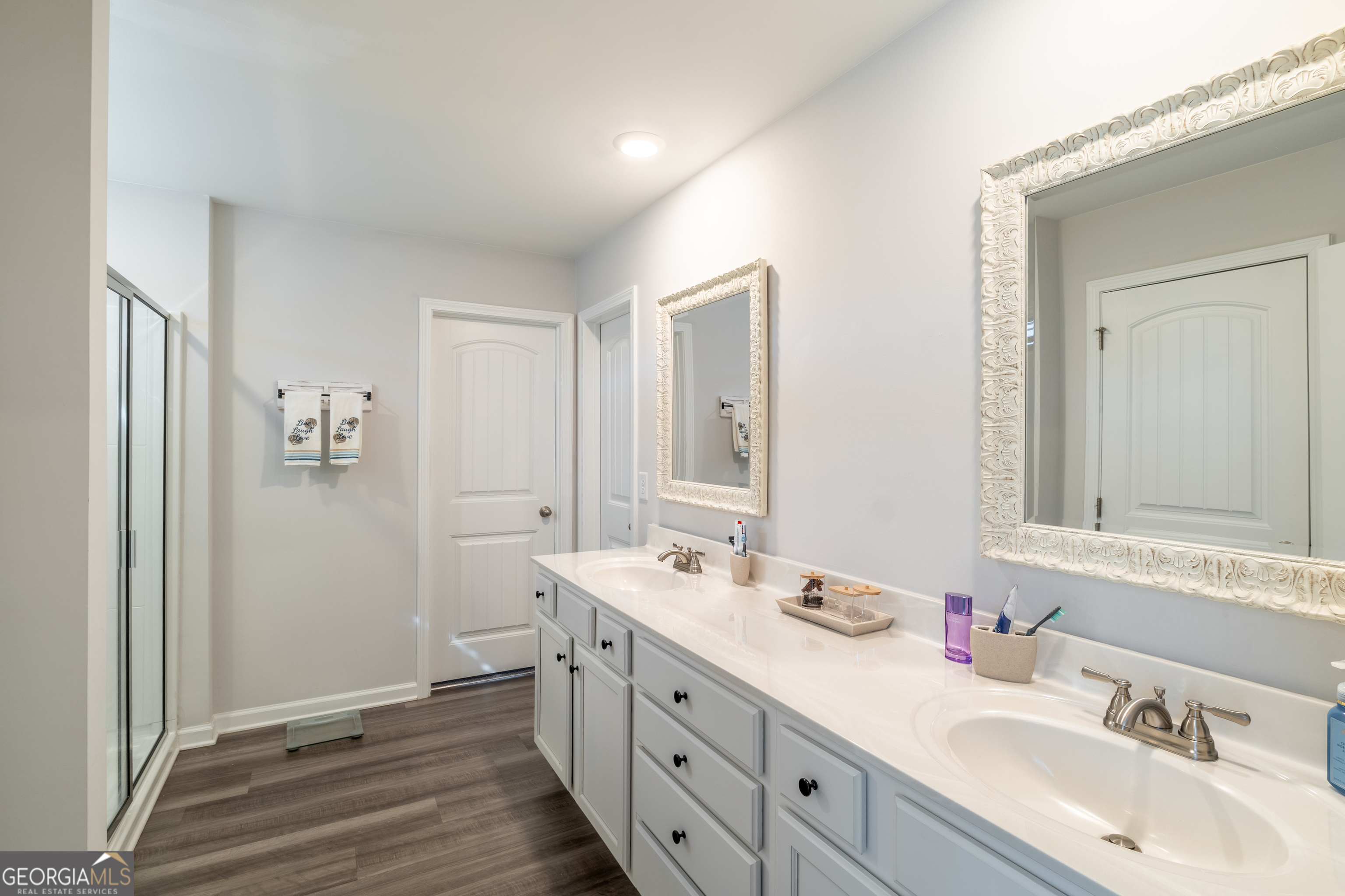 728 Cherokee Rose Bremen, GA 30110 - Photo 41 of 78 a spacious bathroom with a double vanity sink a mirror and a