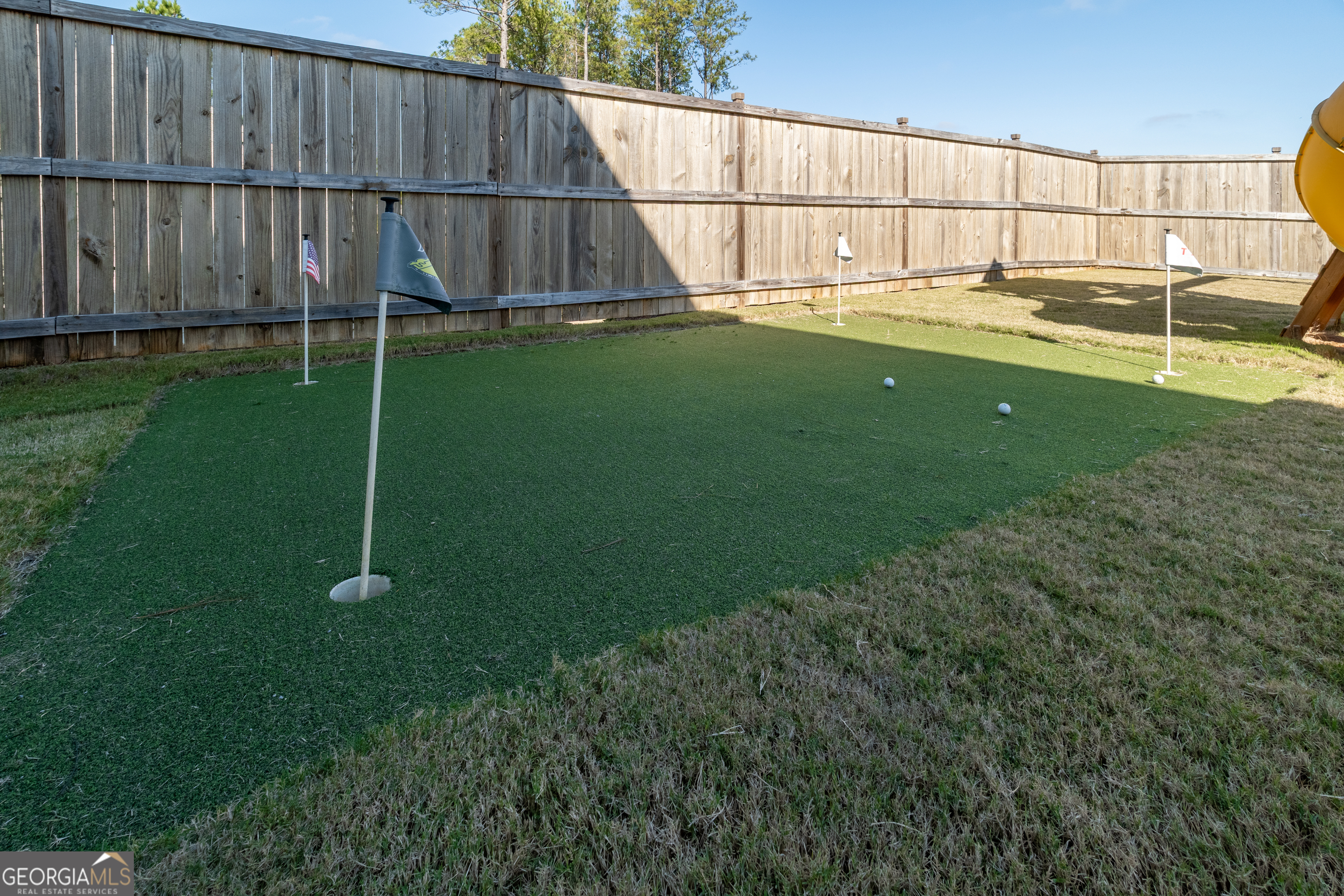728 Cherokee Rose Bremen, GA 30110 - Photo 56 of 78 a view of a backyard with wooden fence