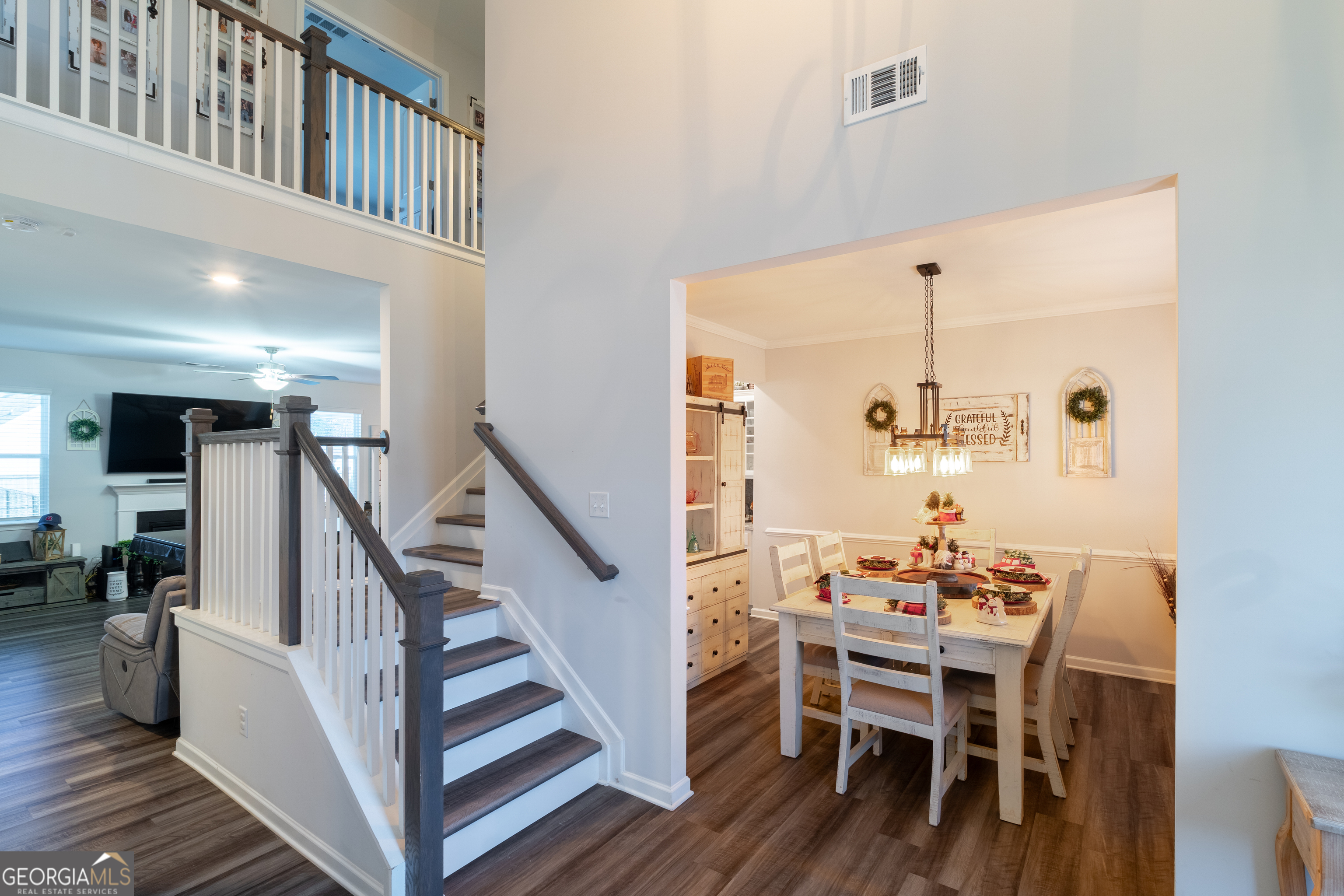 728 Cherokee Rose Bremen, GA 30110 - Photo 6 of 78 a view of a dining room with furniture and wooden floor