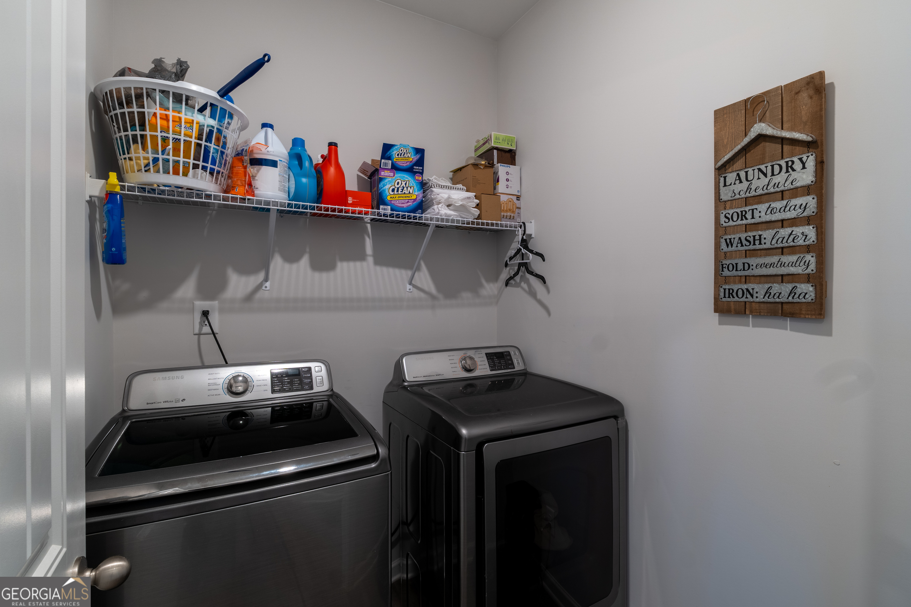 728 Cherokee Rose Bremen, GA 30110 - Photo 62 of 78 a utility room with dryer washer and shoe rack