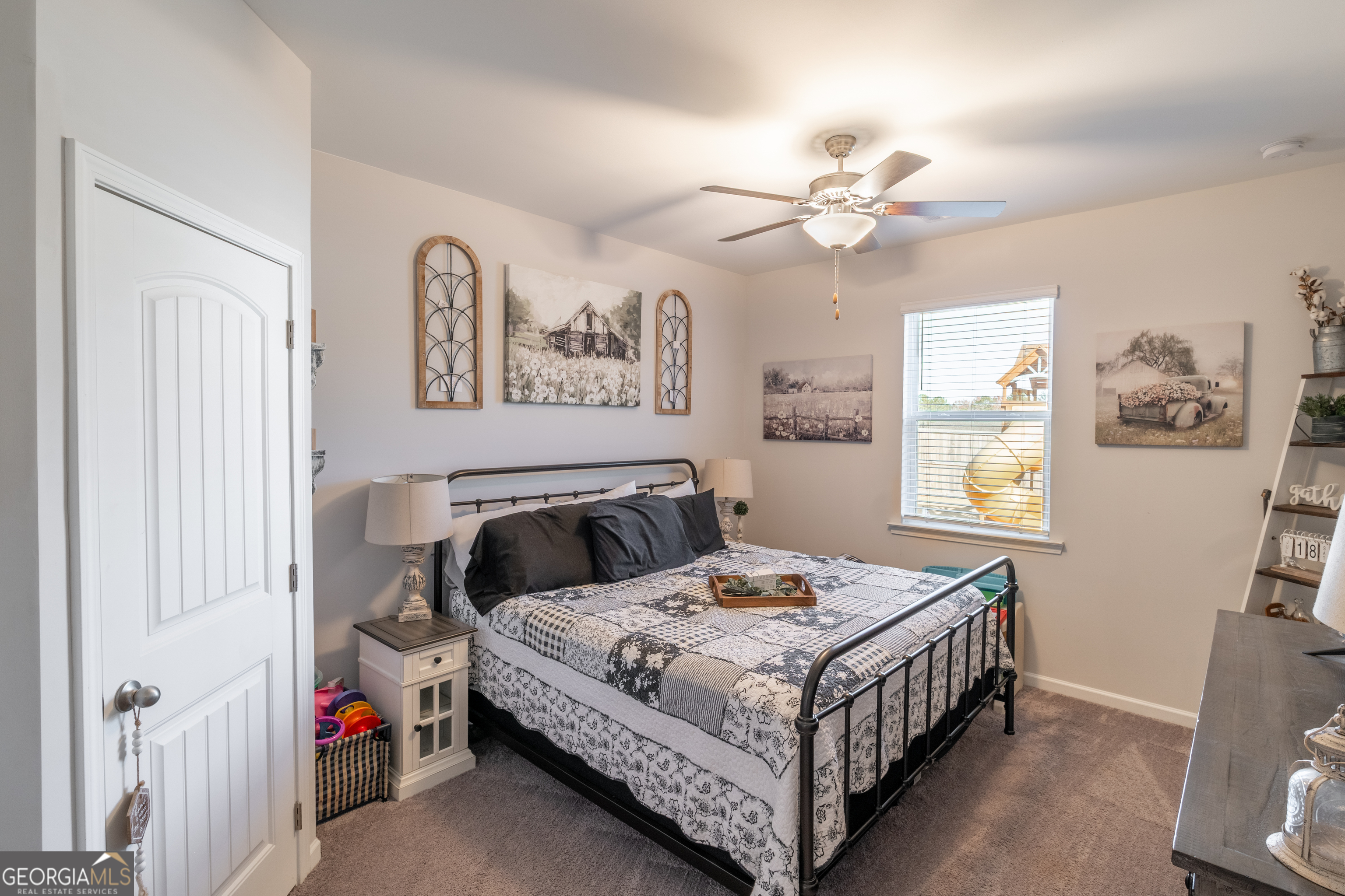 728 Cherokee Rose Bremen, GA 30110 - Photo 63 of 78 a bedroom with a bed and a chandelier