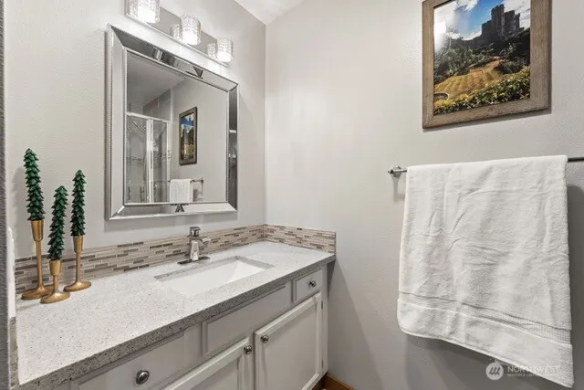 a bathroom with a sink and a mirror