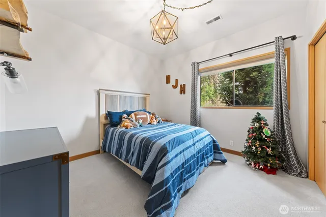 a bathroom with double sink and a mirror
