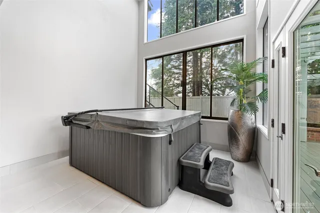 a living room with furniture a large window