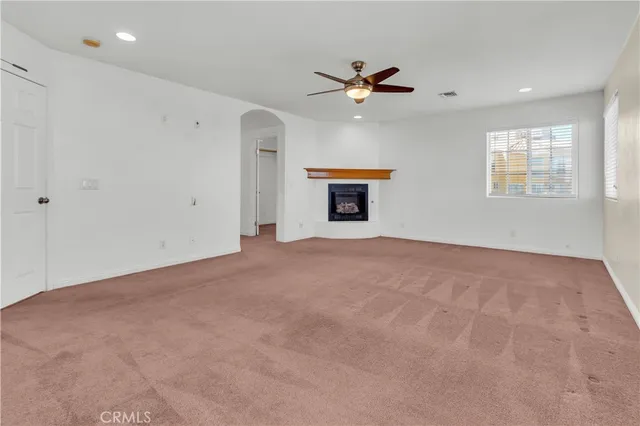 a spacious bathroom with a shower sink and mirror