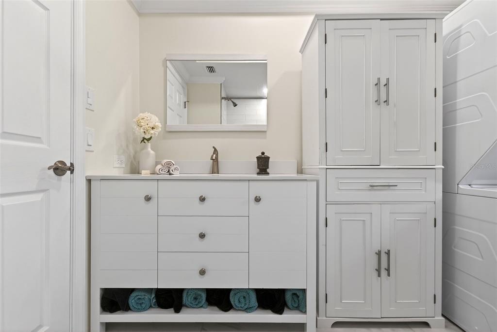 7108 Midnight Pass Road Sarasota, FL 34242 - Photo 51 of 83 a bathroom with a double vanity sink and mirror