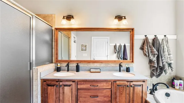 a bathroom with a sink and a mirror