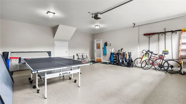 a room with gym equipment and lots of table