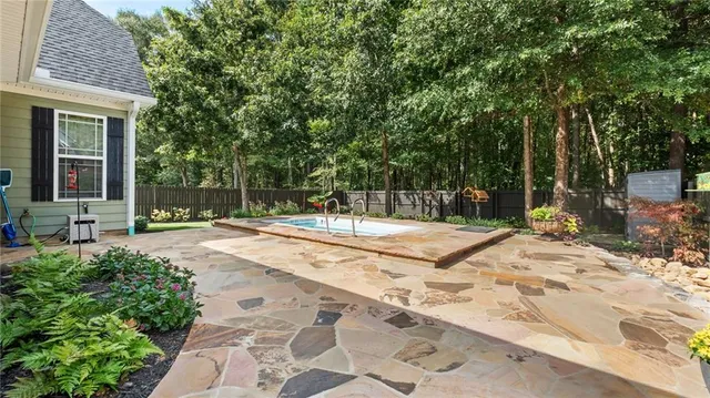 a view of a backyard with a garden and plants