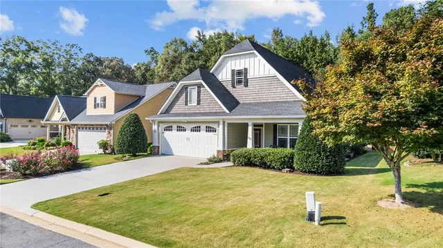 a front view of a house with a yard