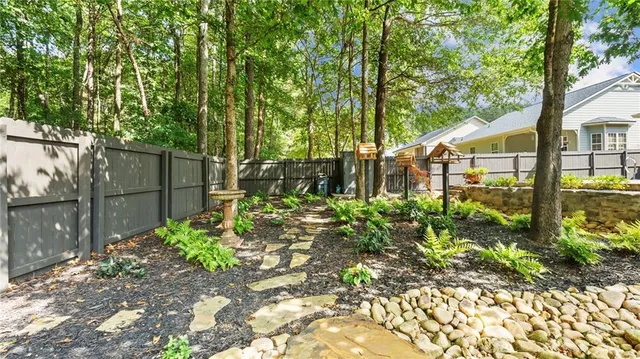 a backyard of a house with lots of green space