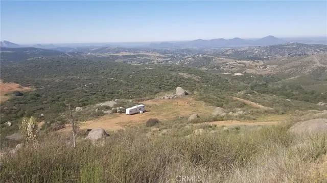 a view of a town with mountains in the background