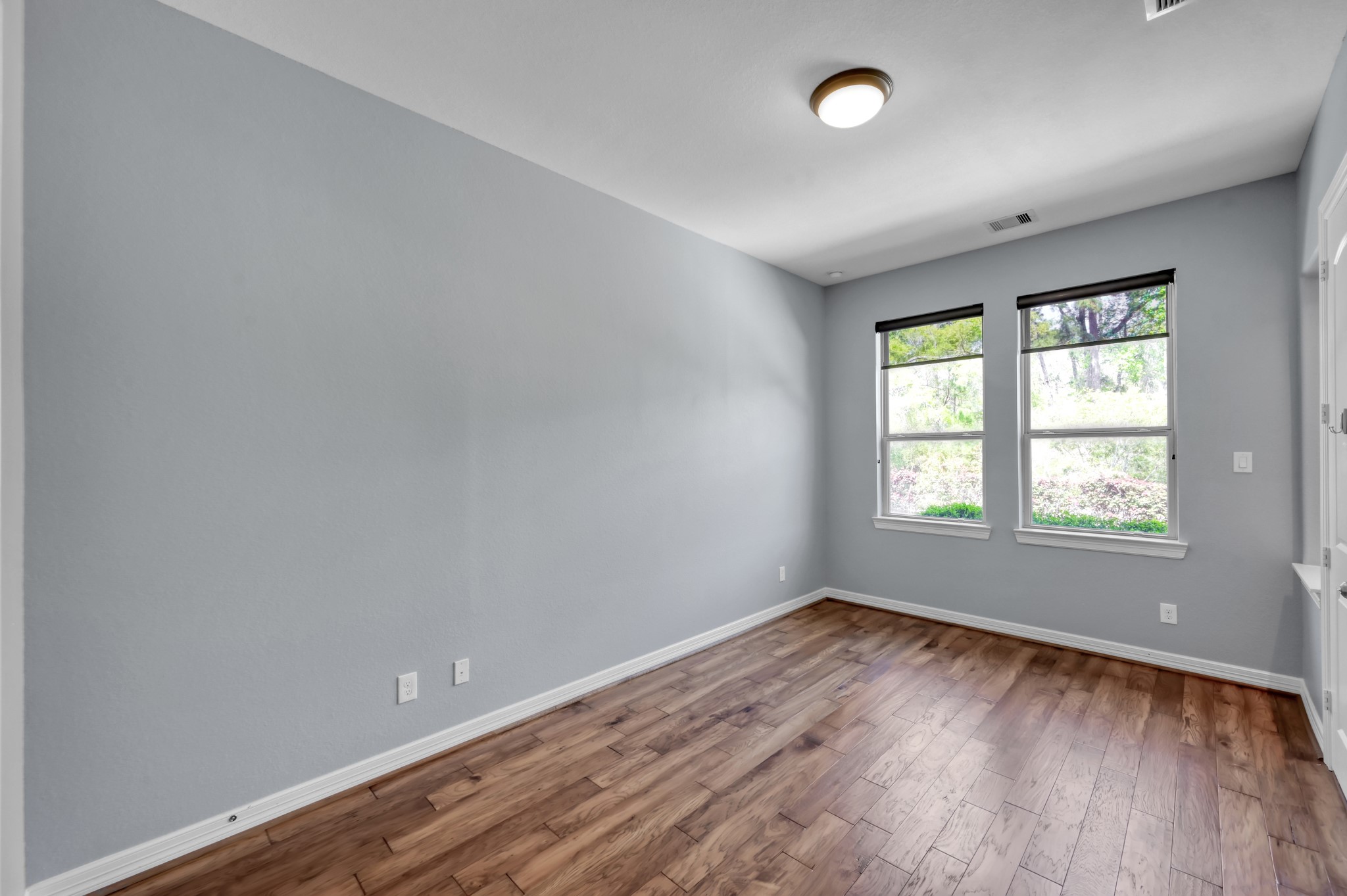 23219 Belted Kingfisher Trail Spring, TX 77389 - Photo 22 of 44 Bedroom 2 located downstairs offers views of the backyard and pool