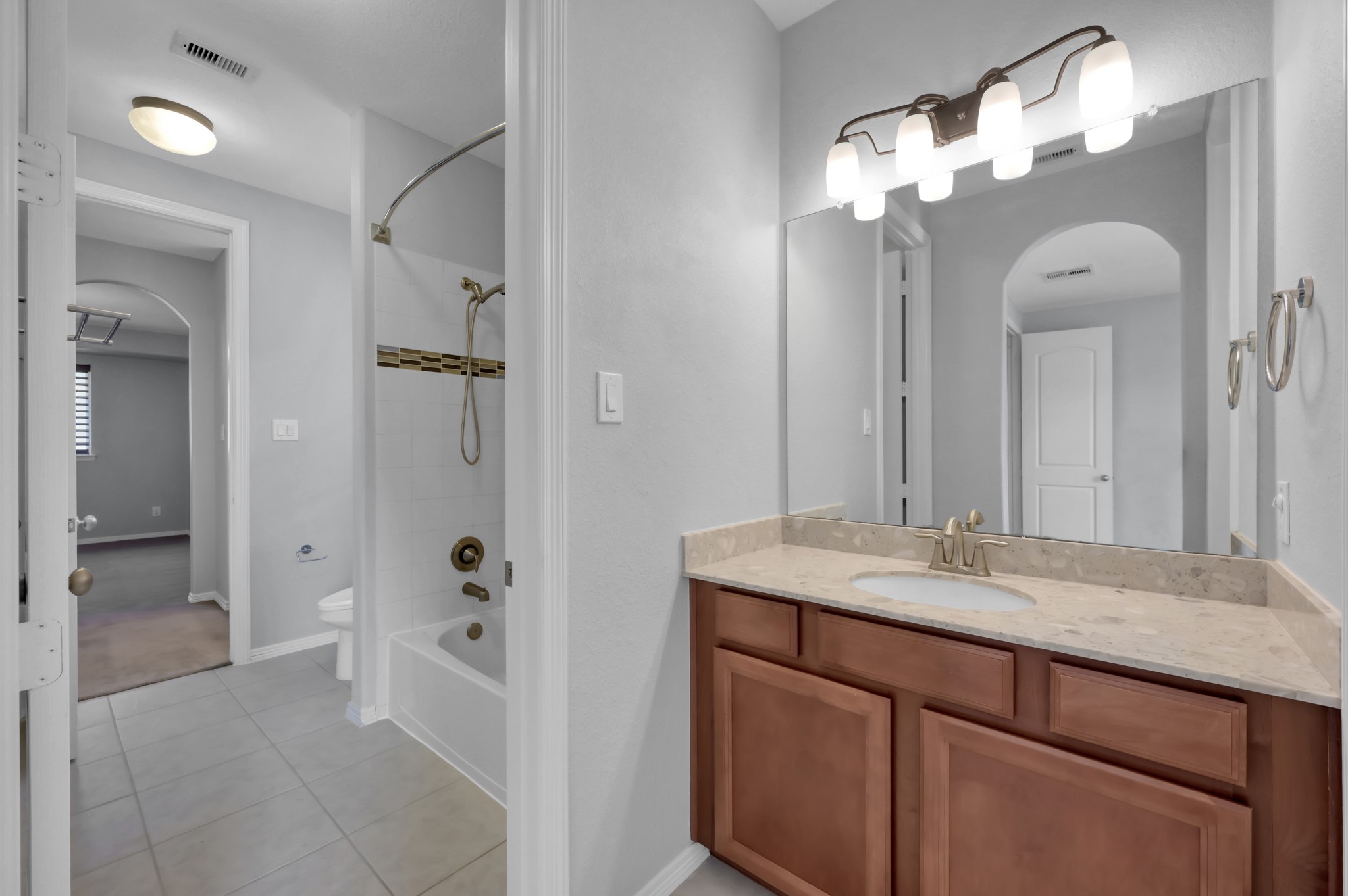 23219 Belted Kingfisher Trail Spring, TX 77389 - Photo 31 of 44 Bedrooms 5 and 6 each have private vanity space while sharing a connecting bath—offering a layout that works well for everyone.