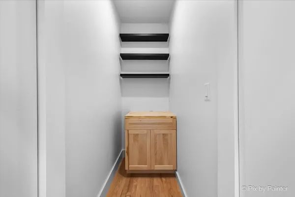 a view of storage and utility room with empty racks