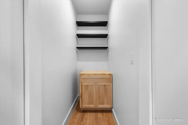 a view of storage and utility room with empty racks